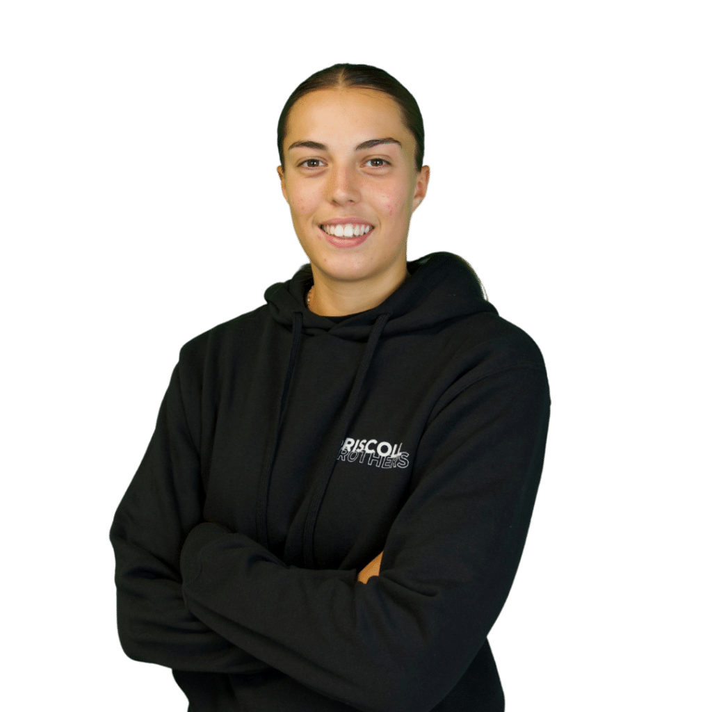 A picture of Poppy stood on an angle with her arms folded